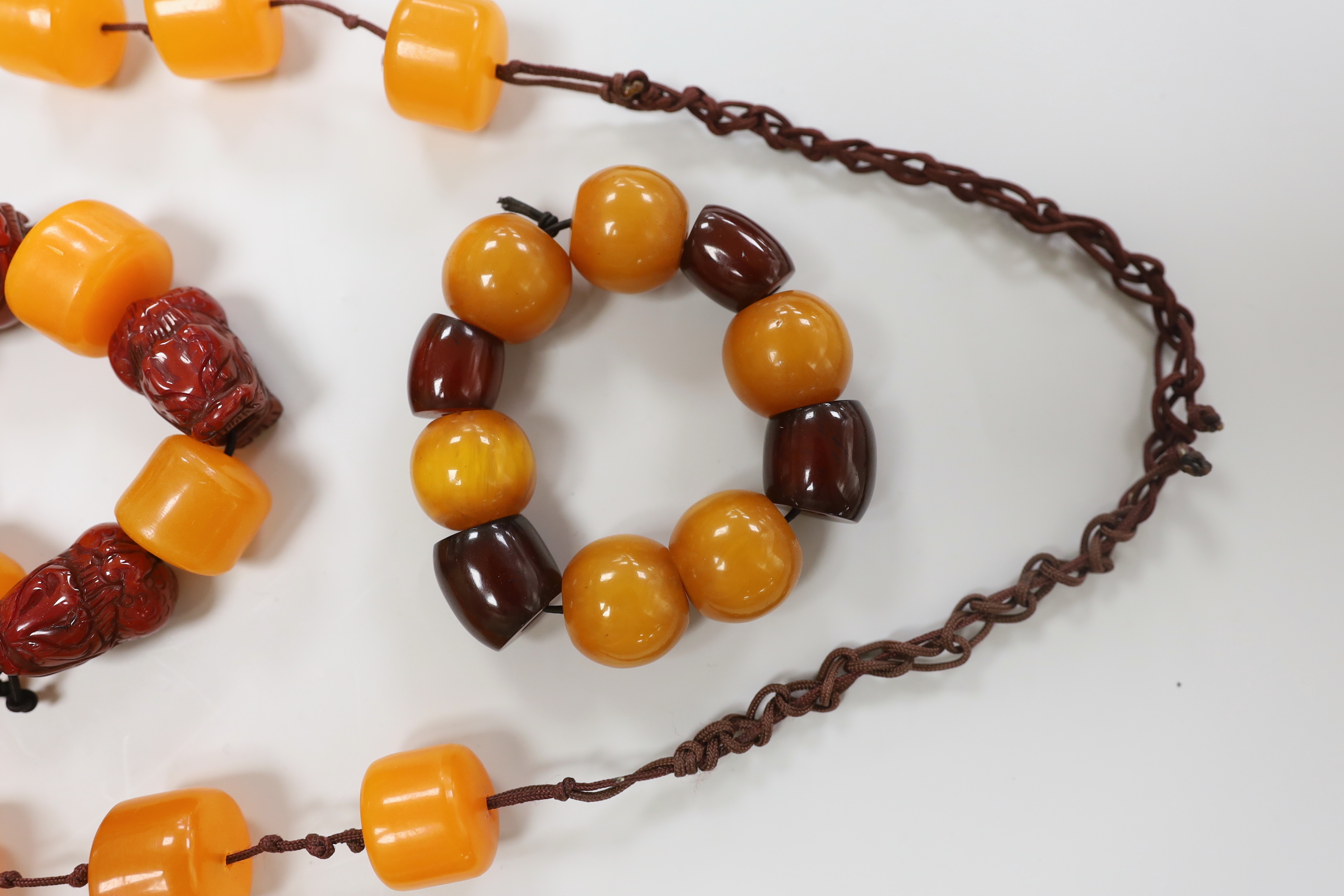 Three assorted amber items